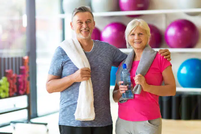senior couple at an exercise class in their retirement community