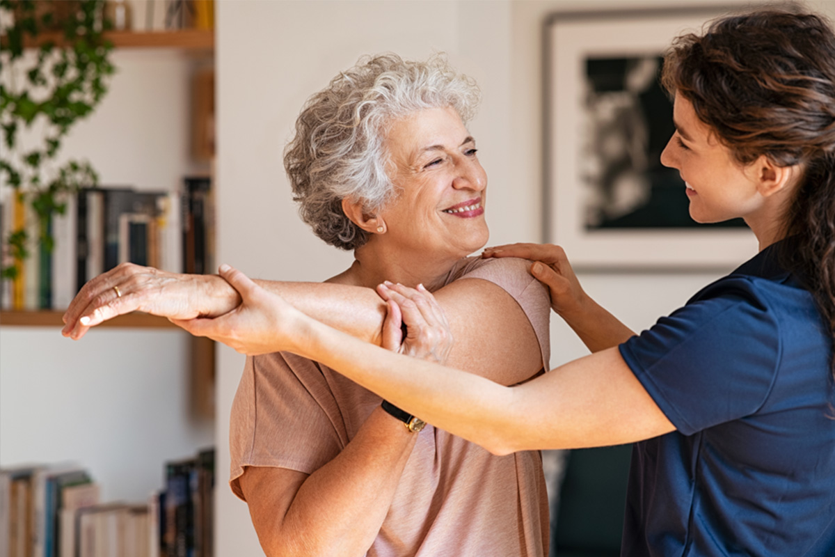 In-home healthcare professional assisting a patient